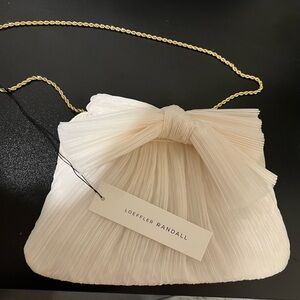 Loeffler Randall

Rayne Bow Pleated Frame Clutch